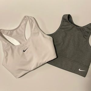 Two Nike sports bras. Light gray and white.